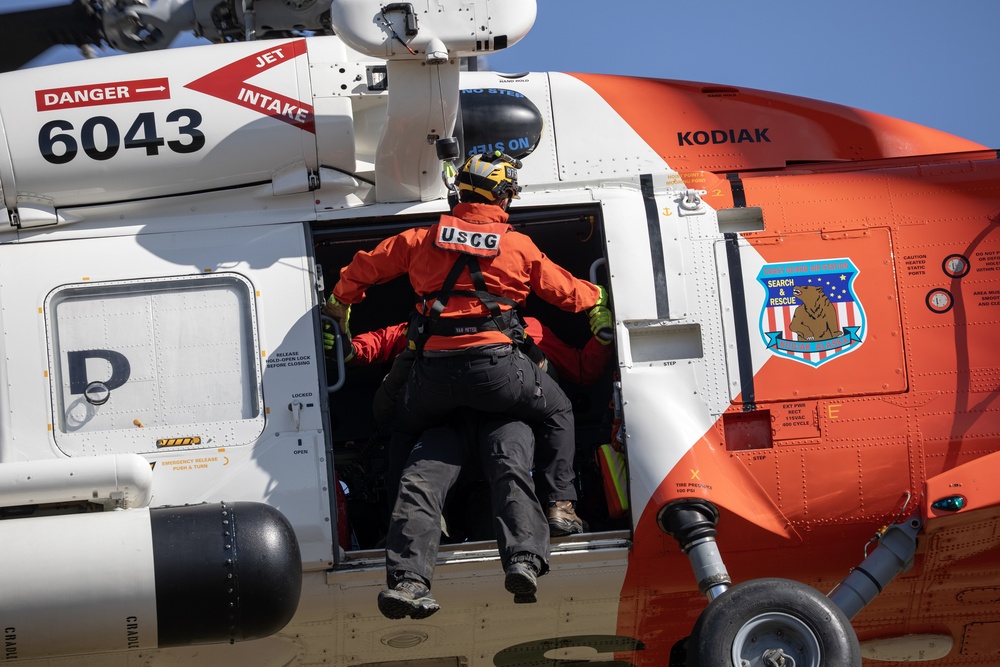 Alaska based Coast Guard aviators showcase rescue demonstration during multi-agency hoist symposium