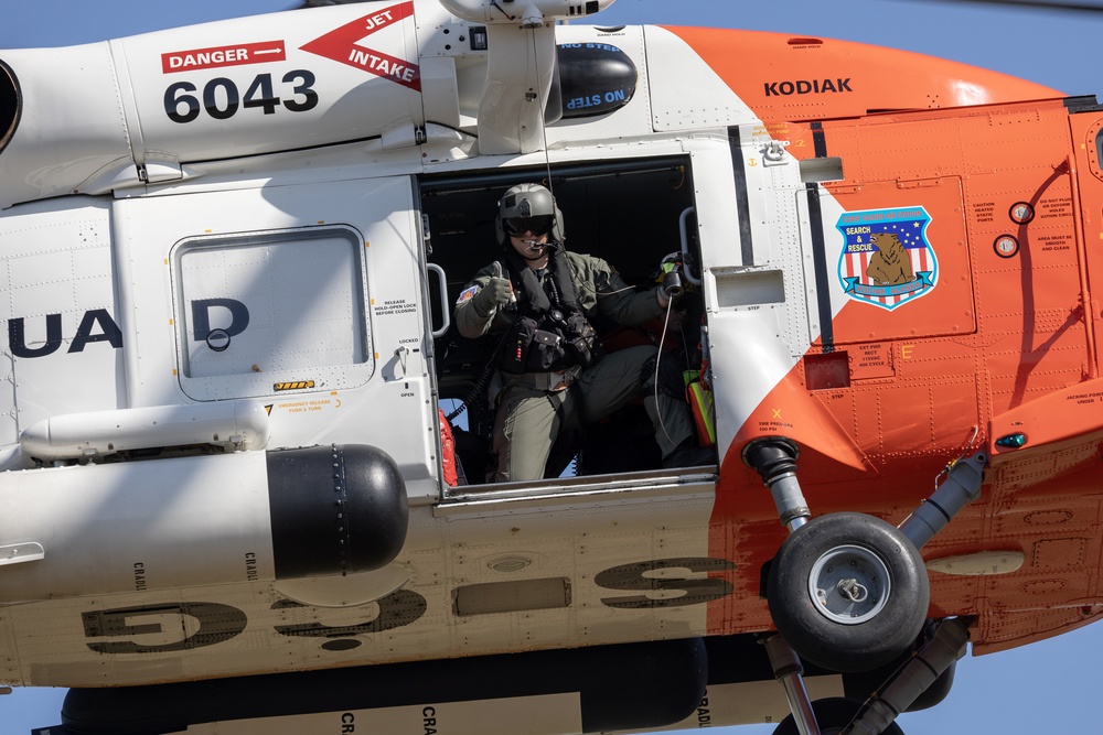 Alaska based Coast Guard aviators showcase rescue demonstration during multi-agency hoist symposium