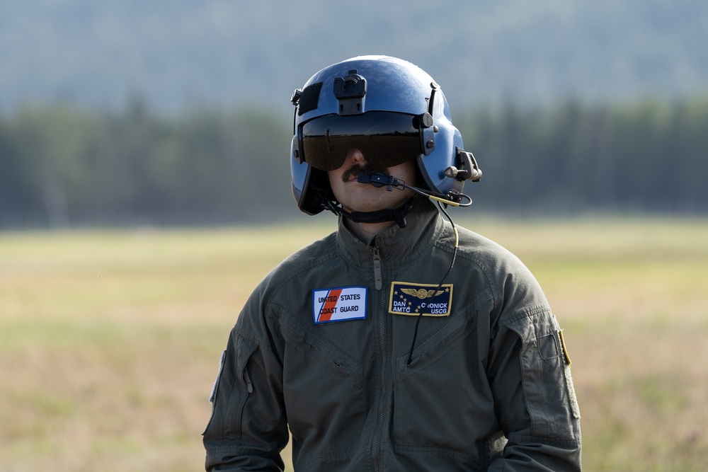 Alaska based Coast Guard aviators showcase rescue demonstration during multi-agency hoist symposium