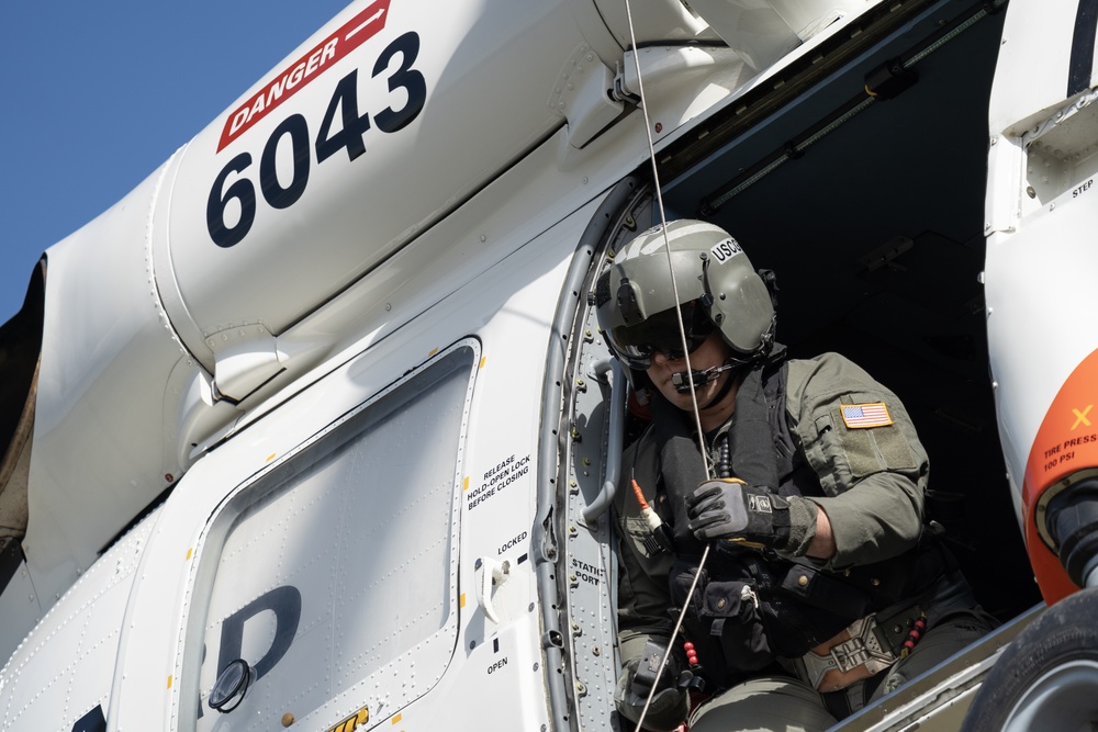Alaska based Coast Guard aviators showcase rescue demonstration during multi-agency hoist symposium