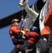 Alaska based Coast Guard aviators showcase rescue demonstration during multi-agency hoist symposium