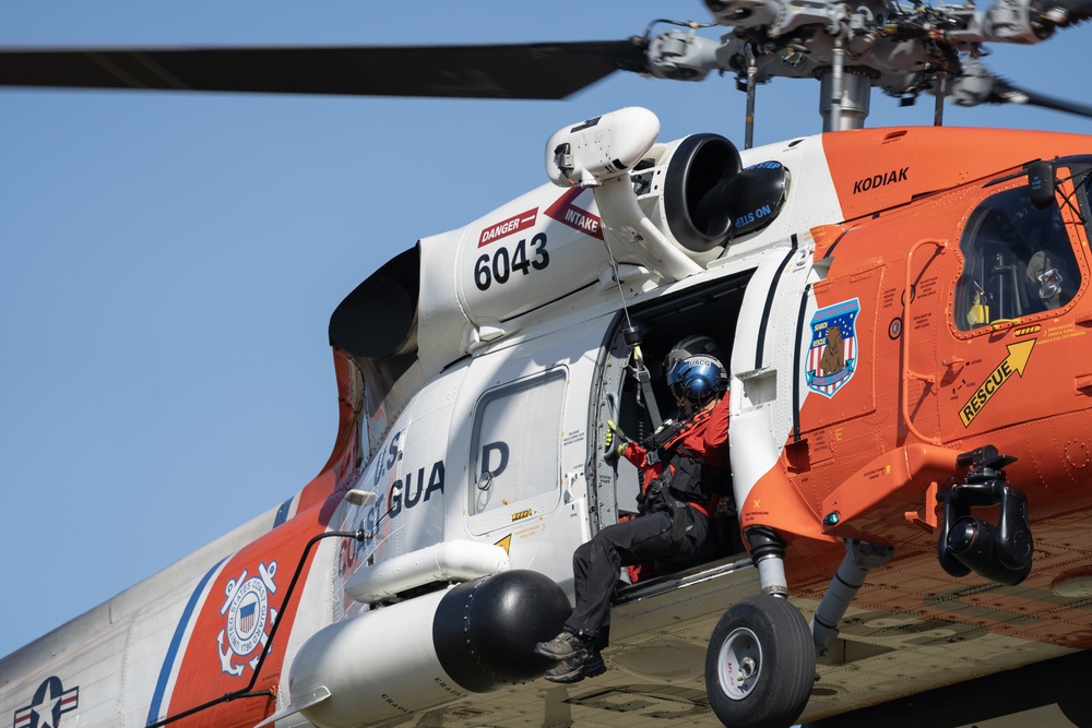 Alaska based Coast Guard aviators showcase rescue demonstration during multi-agency hoist symposium