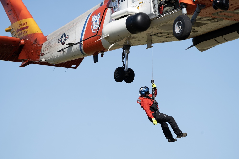 Alaska based Coast Guard aviators showcase rescue demonstration during multi-agency hoist symposium
