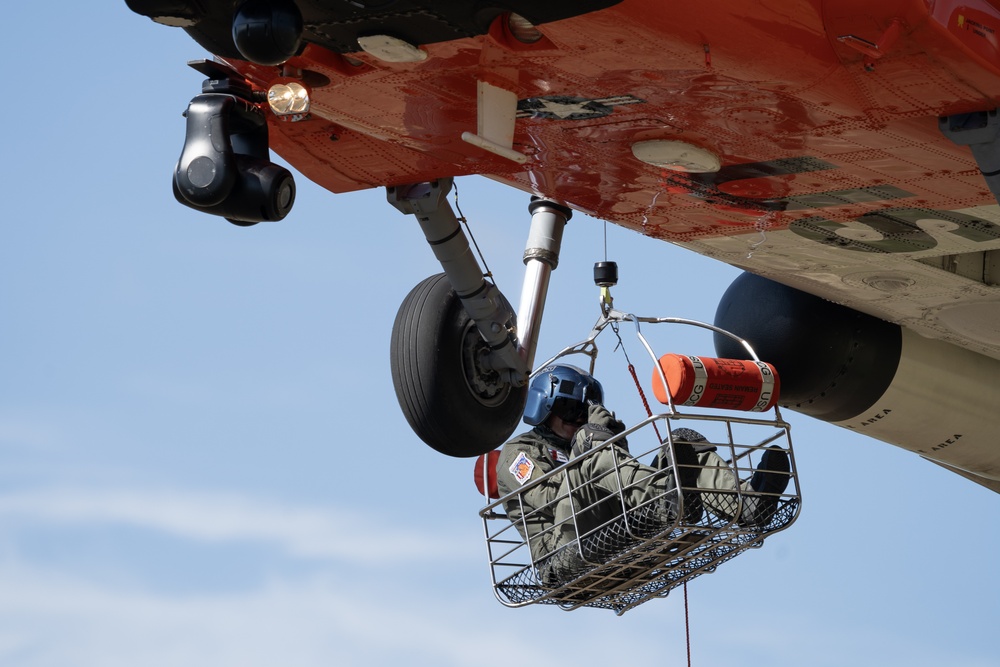 Alaska based Coast Guard aviators showcase rescue demonstration during multi-agency hoist symposium