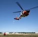 Alaska based Coast Guard aviators showcase rescue demonstration during multi-agency hoist symposium
