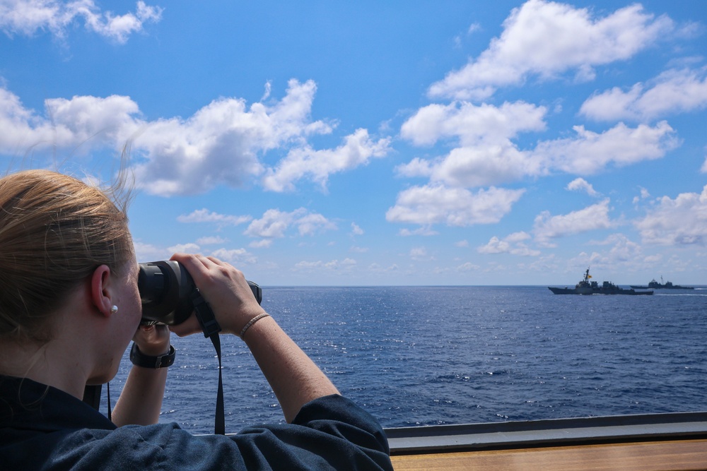 Midshipmen Ashley Sarno uses a laser range finder to verify distance