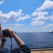 Midshipmen Ashley Sarno uses a laser range finder to verify distance