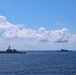 USS Stout and USS Normandy maneuver at sea alongside the USS Bulkeley
