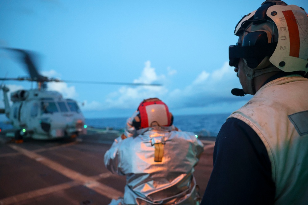 DC3 Asia Taylor, BM1 Youssef Belakbir direct MH-60R Seahawk pilots during flight operations.