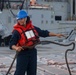 OSSA Tayler Hemphill flakes an aft deck line on the missile deck