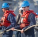 FC3 Vincent Gabriel Concepcion and CTRSA  Cole Muirhead prepare to heave in the aft deck line on the missile deck