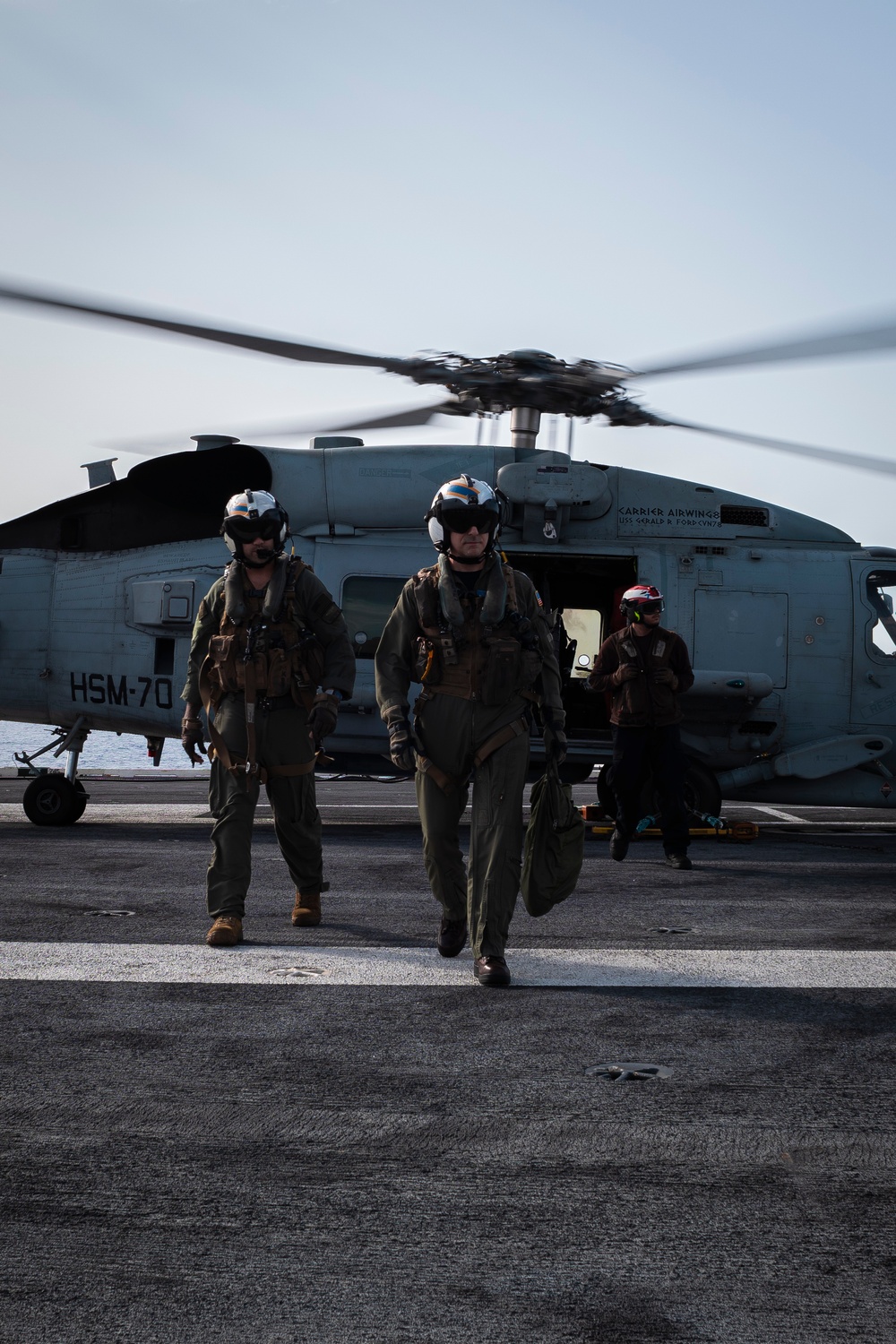 Commander, Carrier Strike Group 12 Disembarks an MH-60R Sea Hawk