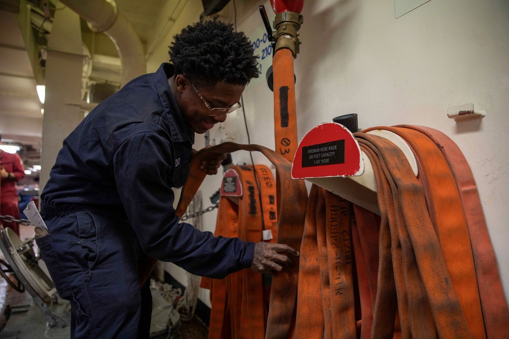 USS Gerald R. Ford (CVN 78) Sailor Restows Fire Hose