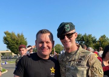 Maj. Gen. Ferguson and Sgt. Maj. of the Army Weimer meet at the finish line of the 2024 Army Ten Miler