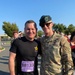 Maj. Gen. Ferguson and Sgt. Maj. of the Army Weimer meet at the finish line of the 2024 Army Ten Miler
