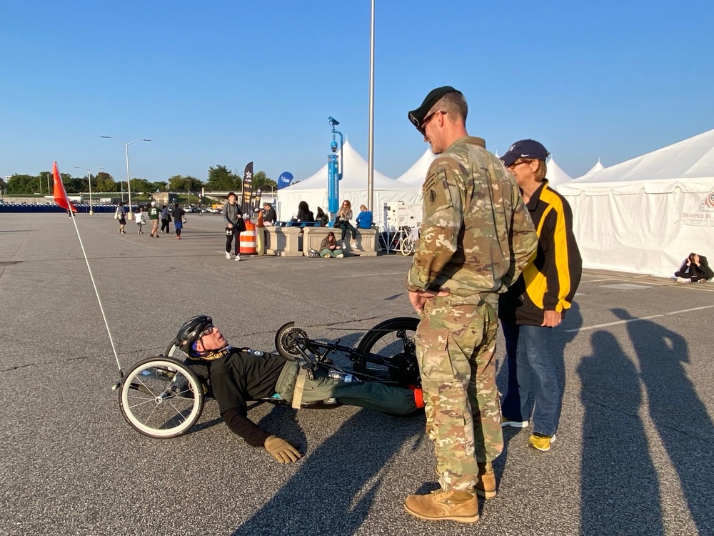 Maj. Gen. Lawrence "Gil" Ferguson congratulates one of the first finishers at the 2024 Army Ten Miler Maj. Gen. Lawrence "Gil" Ferguson congratulates one of the first finishers at the 2024 Army Ten Miler