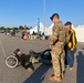 Maj. Gen. Lawrence &quot;Gil&quot; Ferguson congratulates one of the first finishers at the 2024 Army Ten Miler