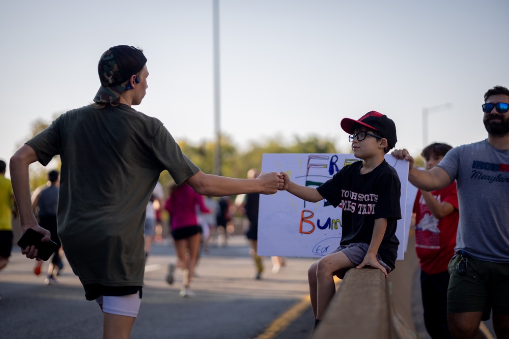 40th Annual Army Ten Miler Participant Reaches to the Crowd for Support 40th Annual Army Ten Miler Participant Reaches to the Crowd for Support