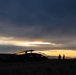 Washington National Guard Black Hawk helicopters at sunset