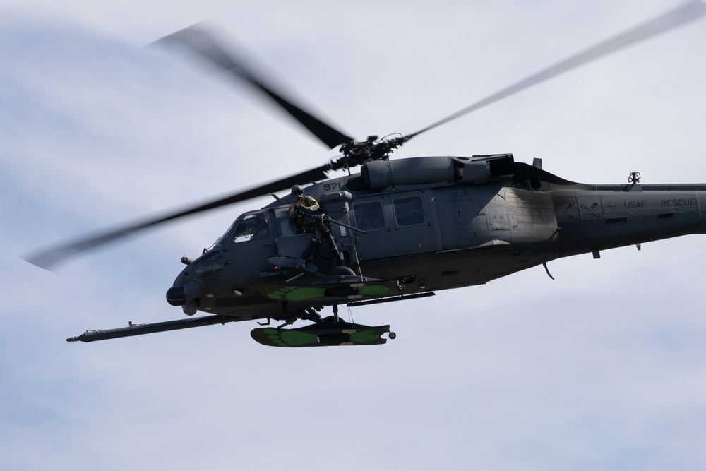 Alaska Air National Guardsmen showcase rescue demonstration during multi-agency hoist symposium