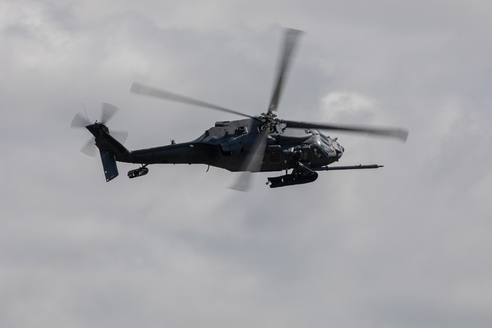 Alaska Air National Guardsmen showcase rescue demonstration during multi-agency hoist symposium