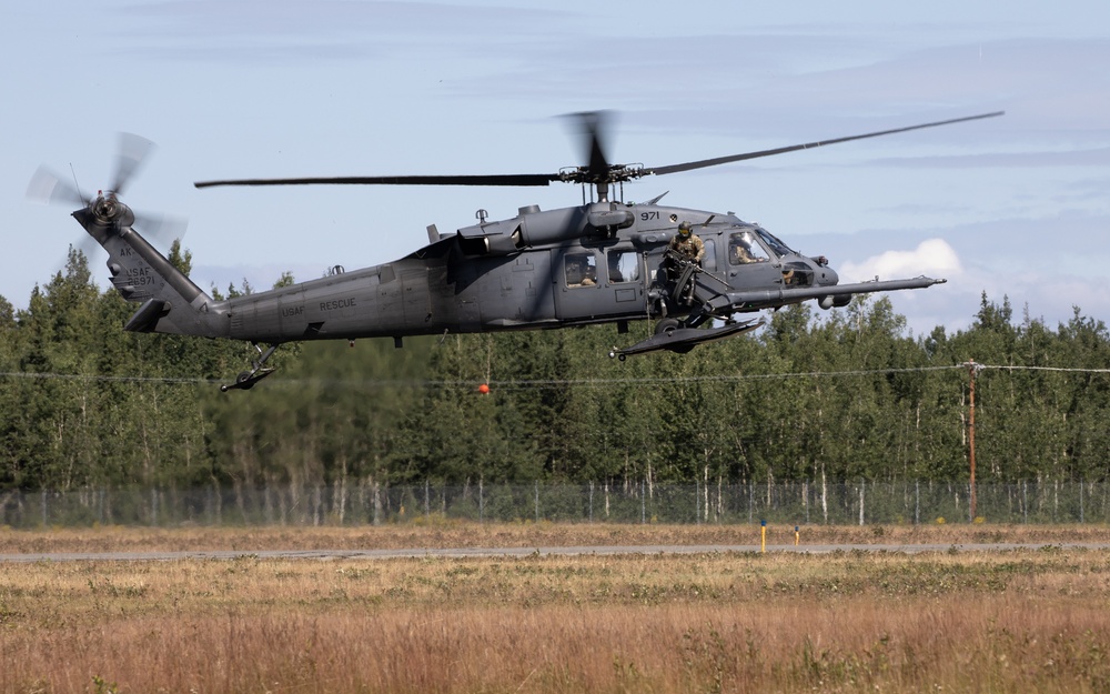 Alaska Air National Guardsmen showcase rescue demonstration during multi-agency hoist symposium