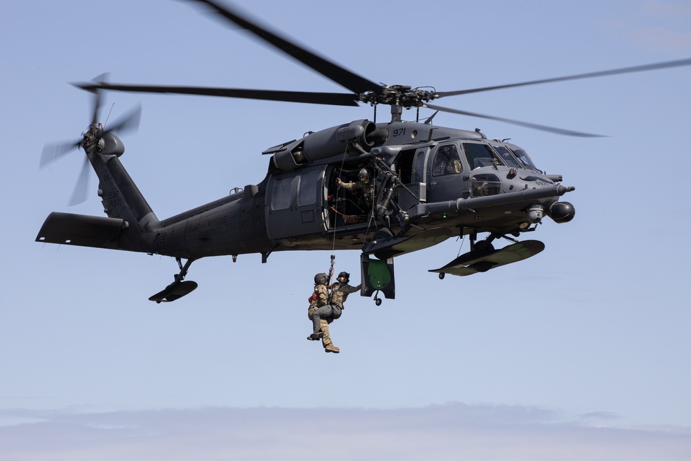 Alaska Air National Guardsmen showcase rescue demonstration during multi-agency hoist symposium
