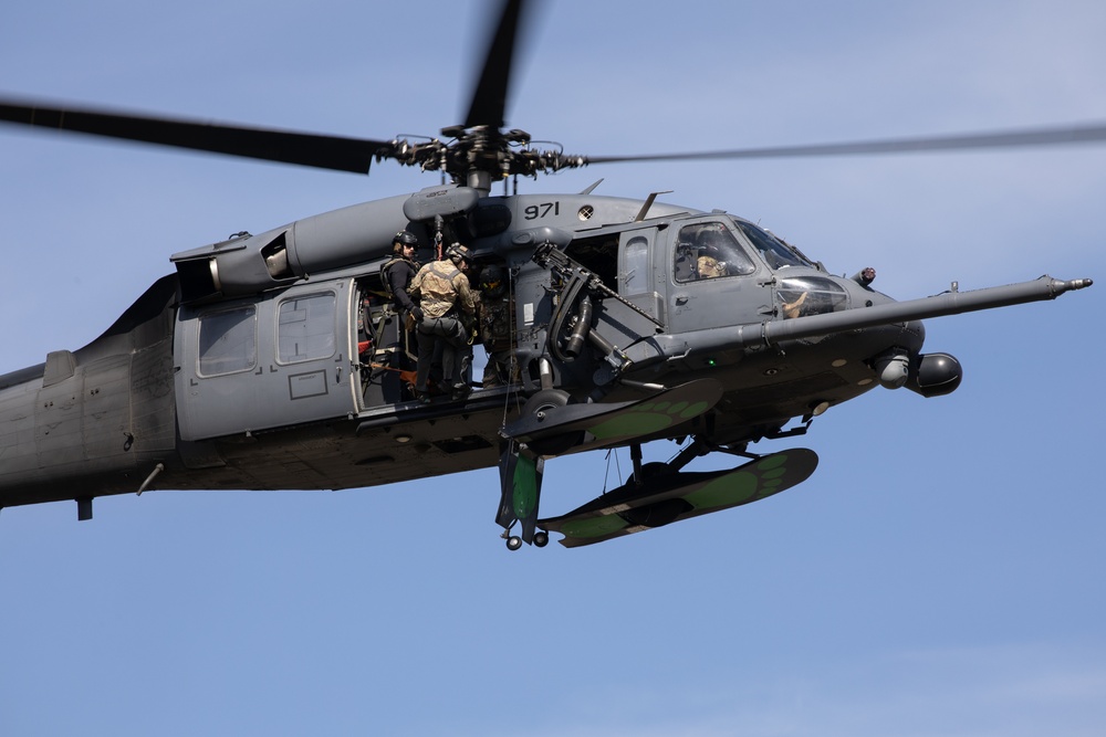 Alaska Air National Guardsmen showcase rescue demonstration during multi-agency hoist symposium