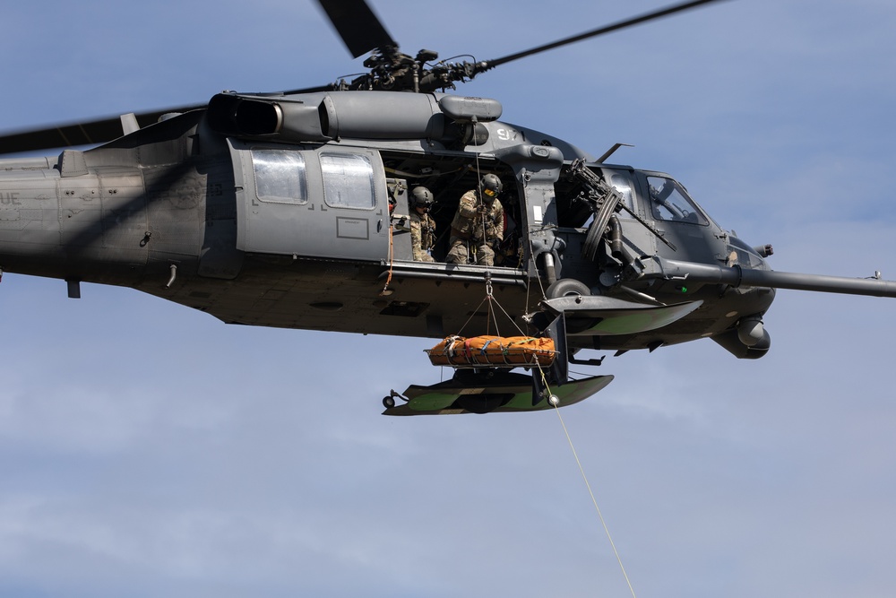 Alaska Air National Guardsmen showcase rescue demonstration during multi-agency hoist symposium