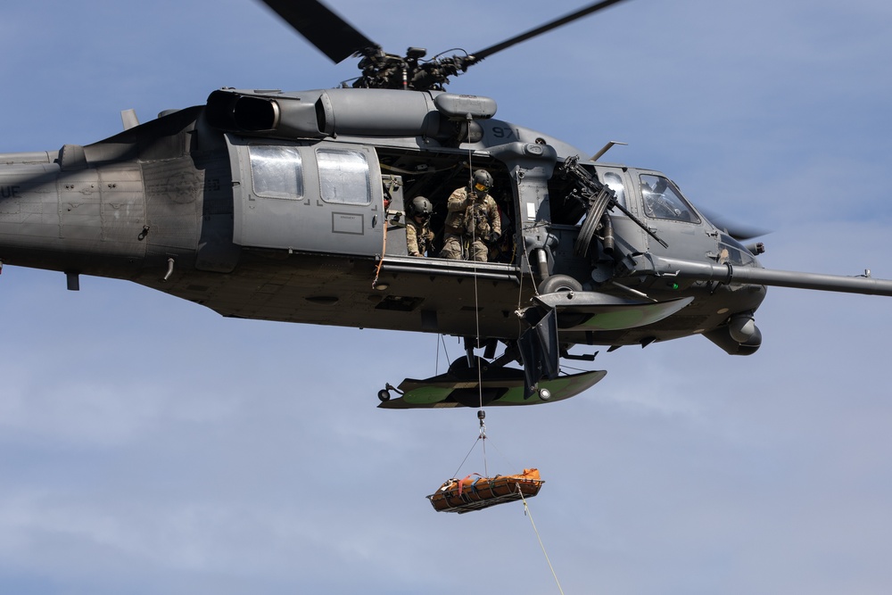 Alaska Air National Guardsmen showcase rescue demonstration during multi-agency hoist symposium