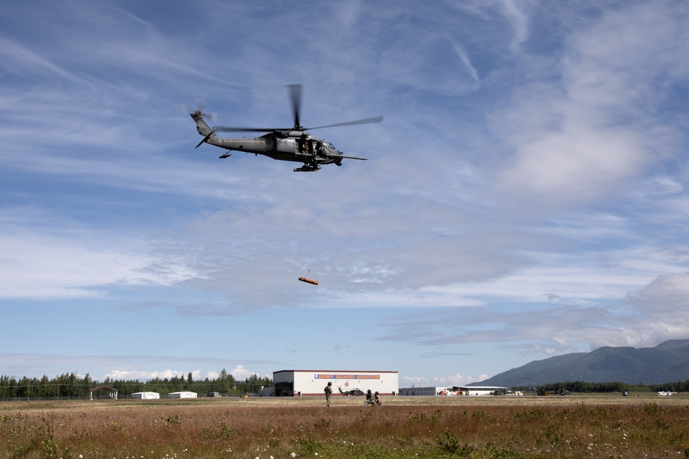 Alaska Air National Guardsmen showcase rescue demonstration during multi-agency hoist symposium