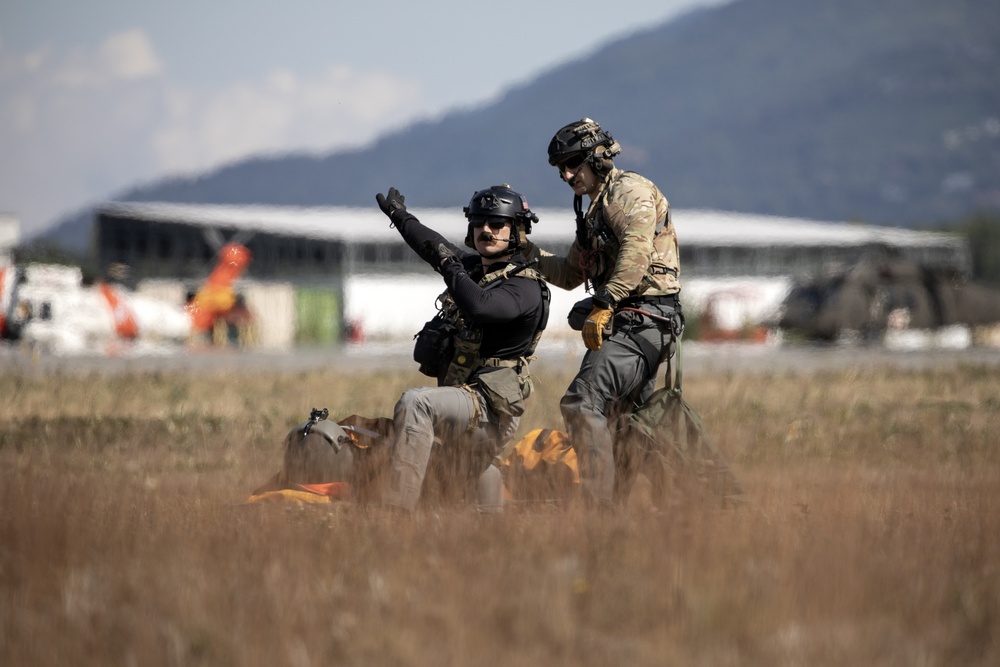 Alaska Air National Guardsmen showcase rescue demonstration during multi-agency hoist symposium