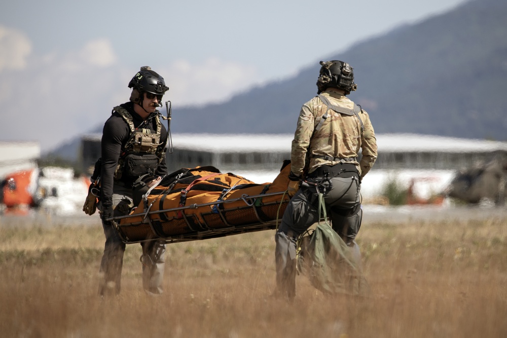 Alaska Air National Guardsmen showcase rescue demonstration during multi-agency hoist symposium