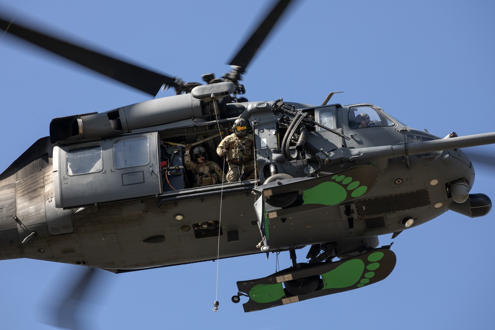 Alaska Air National Guardsmen showcase rescue demonstration during multi-agency hoist symposium