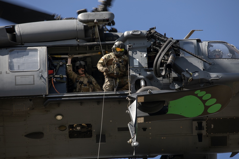 Alaska Air National Guardsmen showcase rescue demonstration during multi-agency hoist symposium