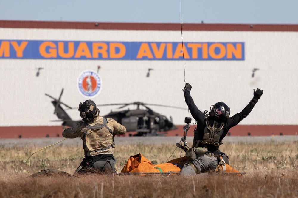 Alaska Air National Guardsmen showcase rescue demonstration during multi-agency hoist symposium