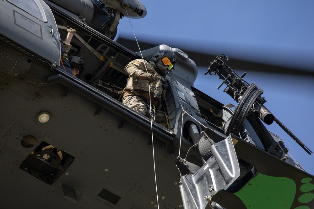 Alaska Air National Guardsmen showcase rescue demonstration during multi-agency hoist symposium