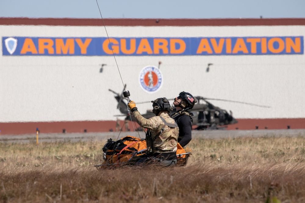 Alaska Air National Guardsmen showcase rescue demonstration during multi-agency hoist symposium