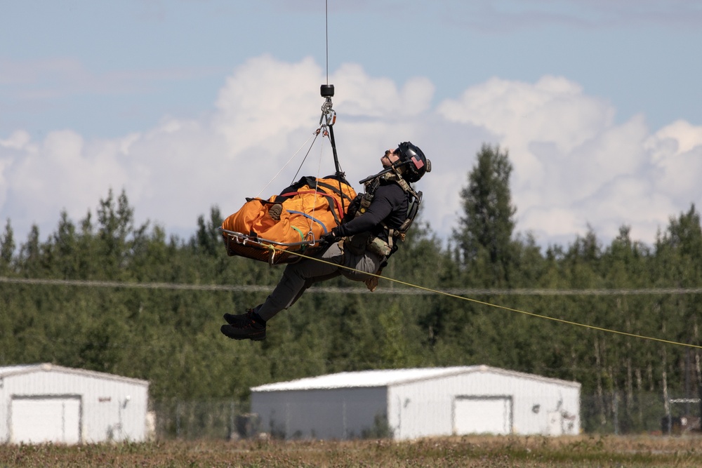 Alaska Air National Guardsmen showcase rescue demonstration during multi-agency hoist symposium