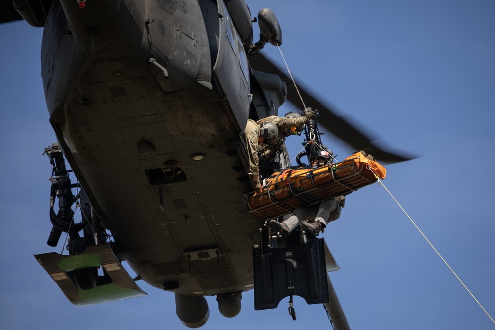 Alaska Air National Guardsmen showcase rescue demonstration during multi-agency hoist symposium