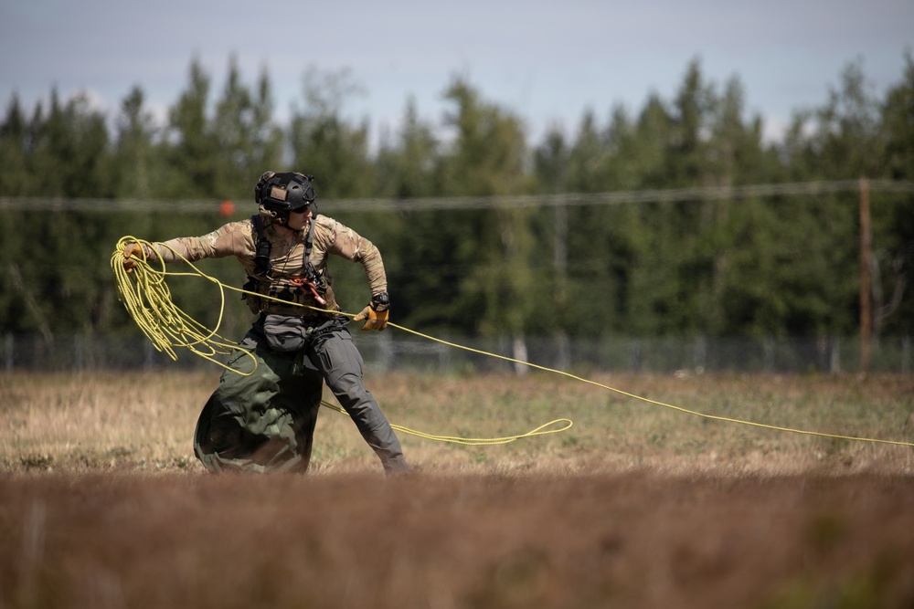Alaska Air National Guardsmen showcase rescue demonstration during multi-agency hoist symposium