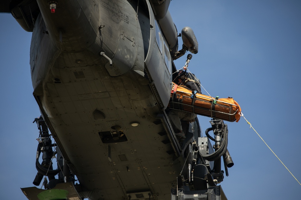Alaska Air National Guardsmen showcase rescue demonstration during multi-agency hoist symposium