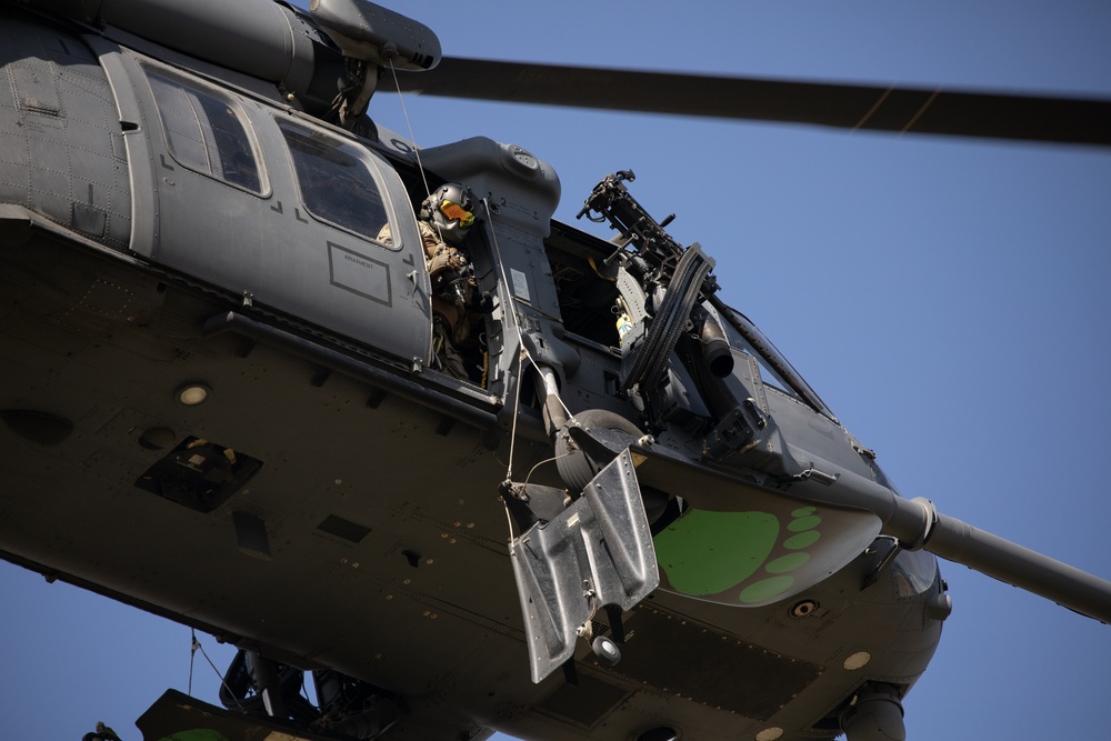 Alaska Air National Guardsmen showcase rescue demonstration during multi-agency hoist symposium