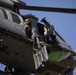 Alaska Air National Guardsmen showcase rescue demonstration during multi-agency hoist symposium