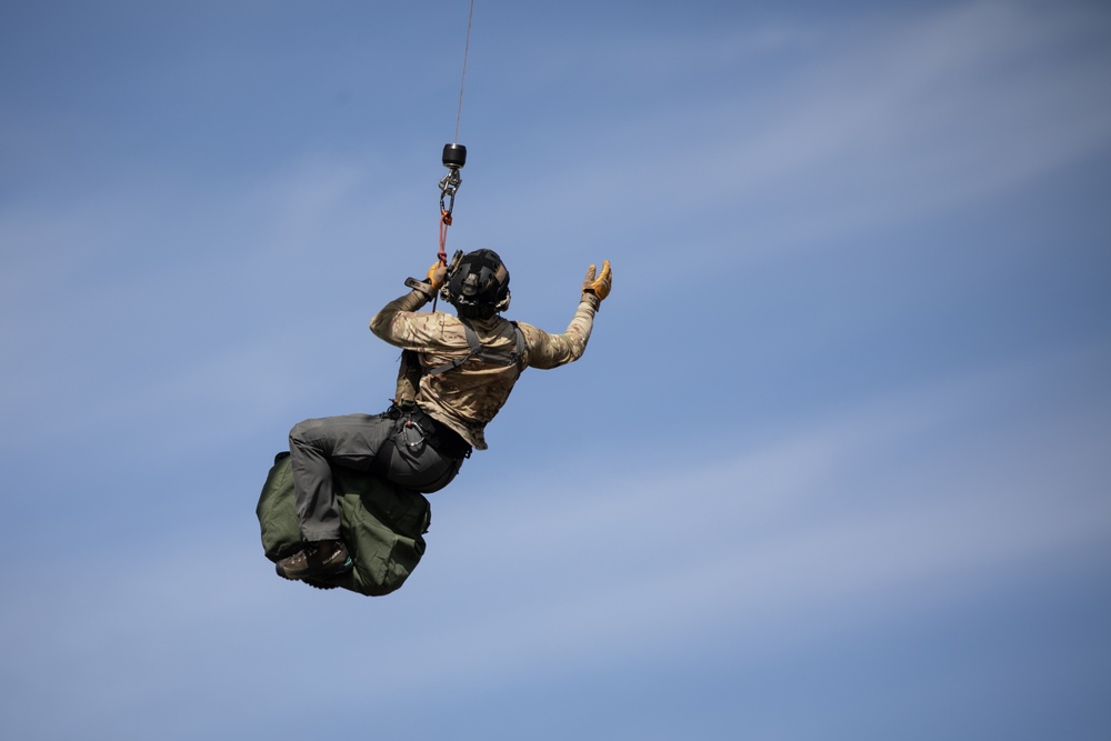 Alaska Air National Guardsmen showcase rescue demonstration during multi-agency hoist symposium