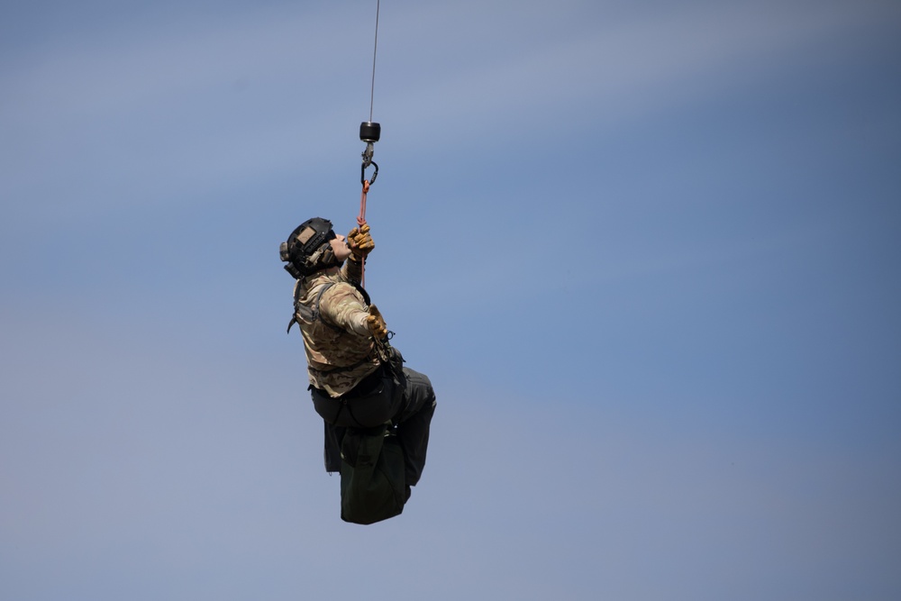 Alaska Air National Guardsmen showcase rescue demonstration during multi-agency hoist symposium