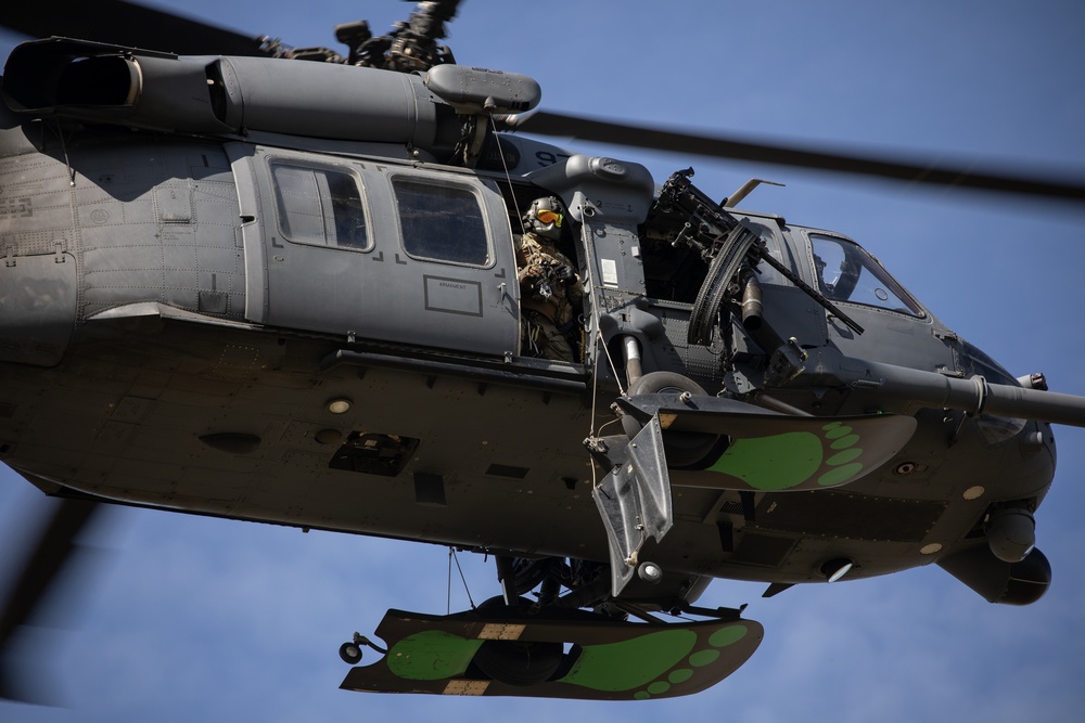 Alaska Air National Guardsmen showcase rescue demonstration during multi-agency hoist symposium
