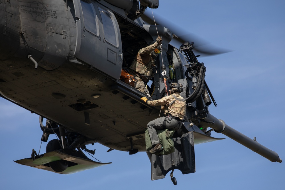Alaska Air National Guardsmen showcase rescue demonstration during multi-agency hoist symposium