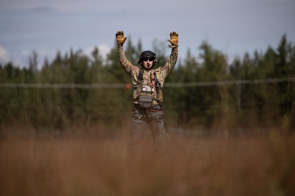 Alaska Air National Guardsmen showcase rescue demonstration during multi-agency hoist symposium