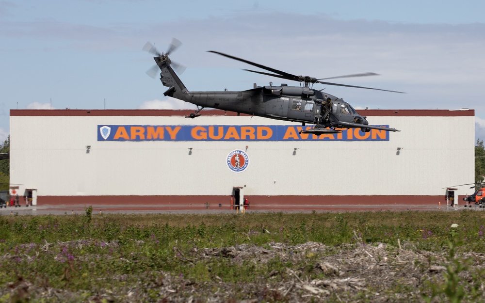 Alaska Air National Guardsmen showcase rescue demonstration during multi-agency hoist symposium